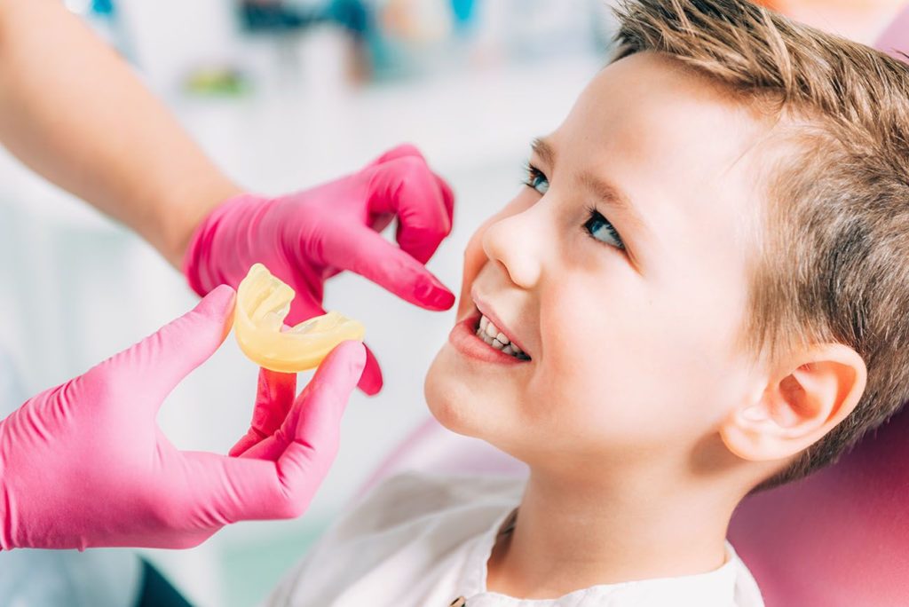young boy at the dentist getting a dental impression pediatric dentistry dentist in Indianapolis Indiana